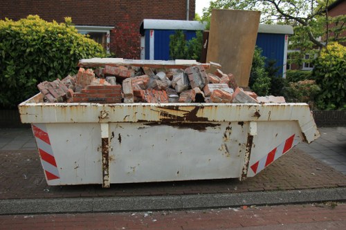 East London residents arranging furniture for disposal