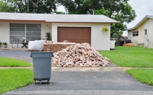 Professional waste collectors handling furniture disposal